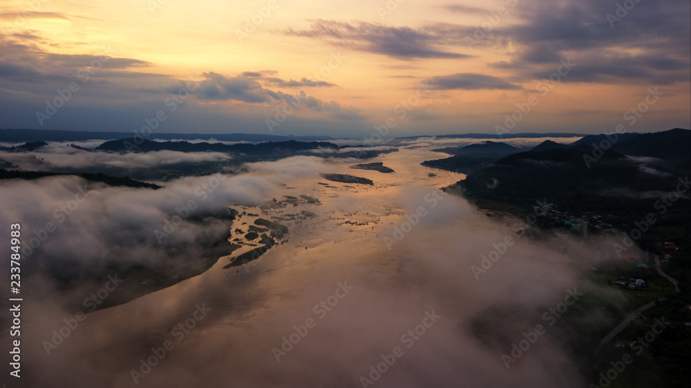 Obraz premium Beautiful aerial view Mekong river between Thai-Laos in during sunrise and foggy view from drone fly.