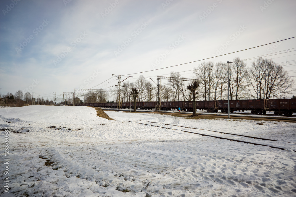 Obraz premium snow and ice covered road in countryside in winter