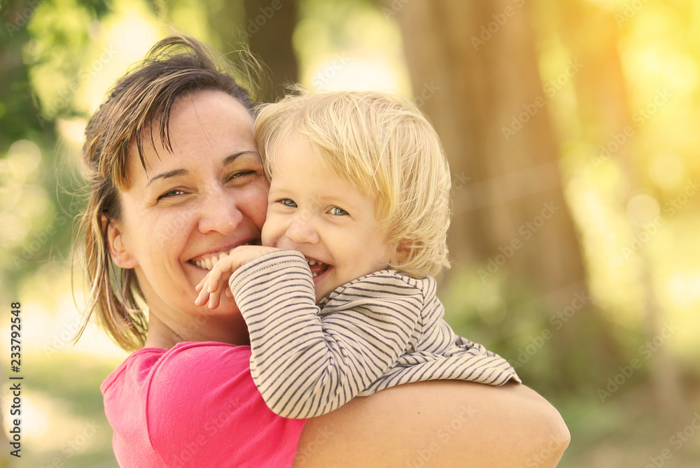 Cute young child hug her mom Cute young child hug her mom