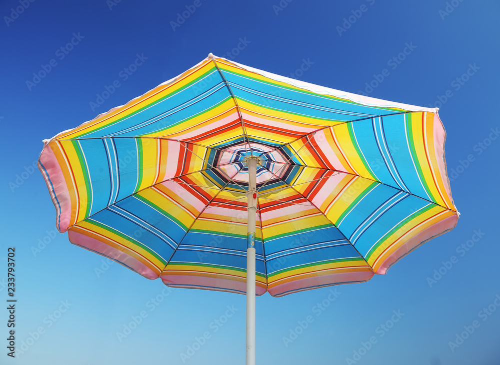 Detail of beach parasol at blue sky