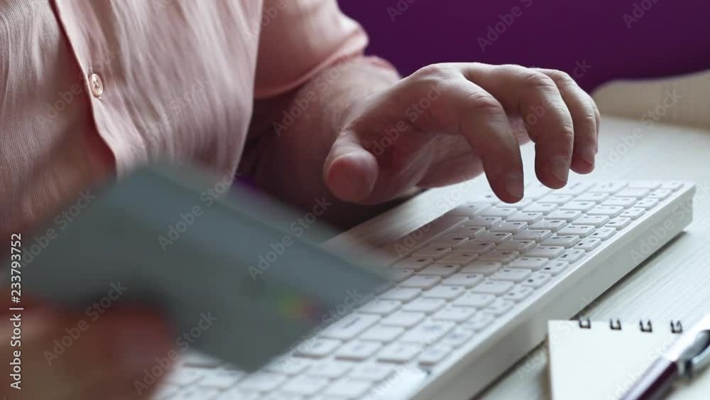 Male hands hold credit card pressing buttons and making online purchase closeup anti-fraud and financial security entering client discount program number filling personal information concept. Male hands hold credit card pressing buttons and making online purchase closeup anti-fraud and financial security entering client discount program number filling personal information concept.