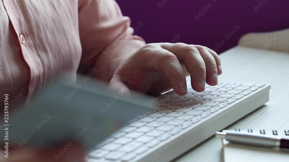 Male hands hold credit card pressing buttons and making online purchase closeup anti-fraud and financial security entering client discount program number filling personal information concept. Male hands hold credit card pressing buttons and making online purchase closeup anti-fraud and financial security entering client discount program number filling personal information concept.
