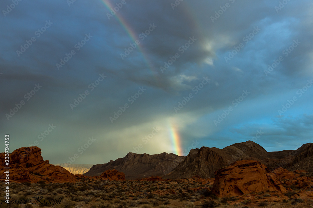 rainbow over red mountains