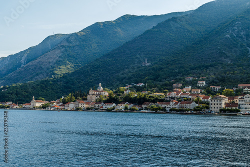 The city on the beach at the foot of the high mountains in Montenegro