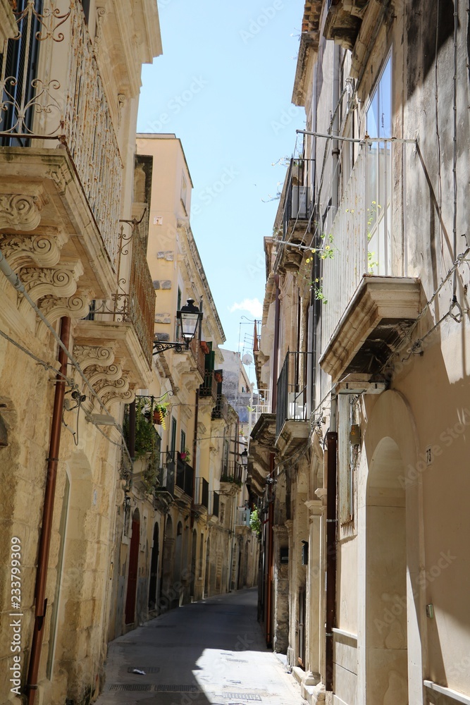 Fototapeta premium Narrow alley in the old Town Ortigia Syracuse, Sicily Italy 