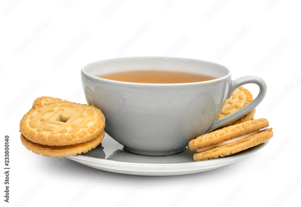 Cup of tea with sandwich cookies on on saucer. Isolated on white. Cup of tea with sandwich cookies on on saucer. Isolated on white.