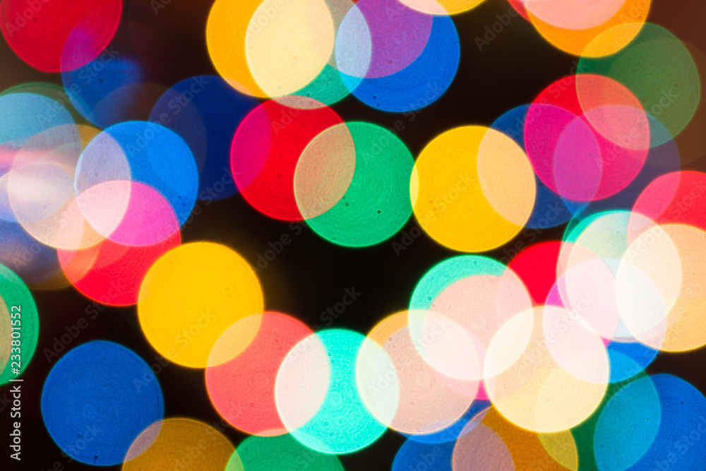 Christmas background in defocused lights. Colorful bokeh. Christmas background in defocused lights. Colorful bokeh.