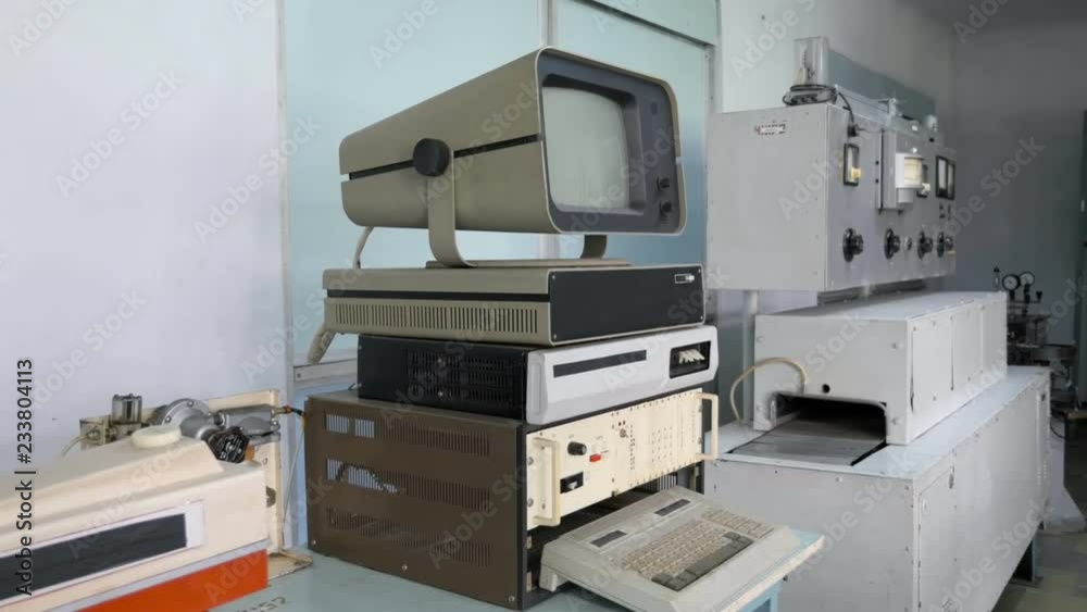 Retro Computer Machine. Side View Of Old Computer And Electronic Equipment Retro Computer Machine. Side View Of Old Computer And Electronic Equipment