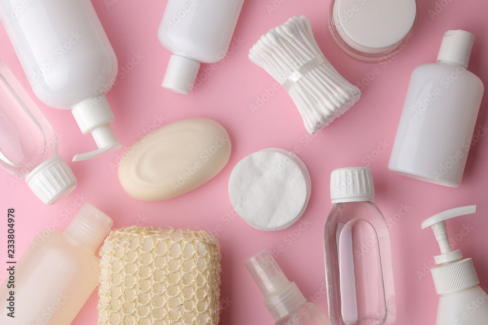 Obraz premium Body and skin care products in white packaging on a pink delicate background. Personal hygiene products. View from above. Flat lay