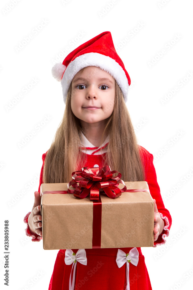 Cute christmas girl giving the gift box, wearing a santa hat isolated over a white background Cute christmas girl giving the gift box, wearing a santa hat isolated over a white background