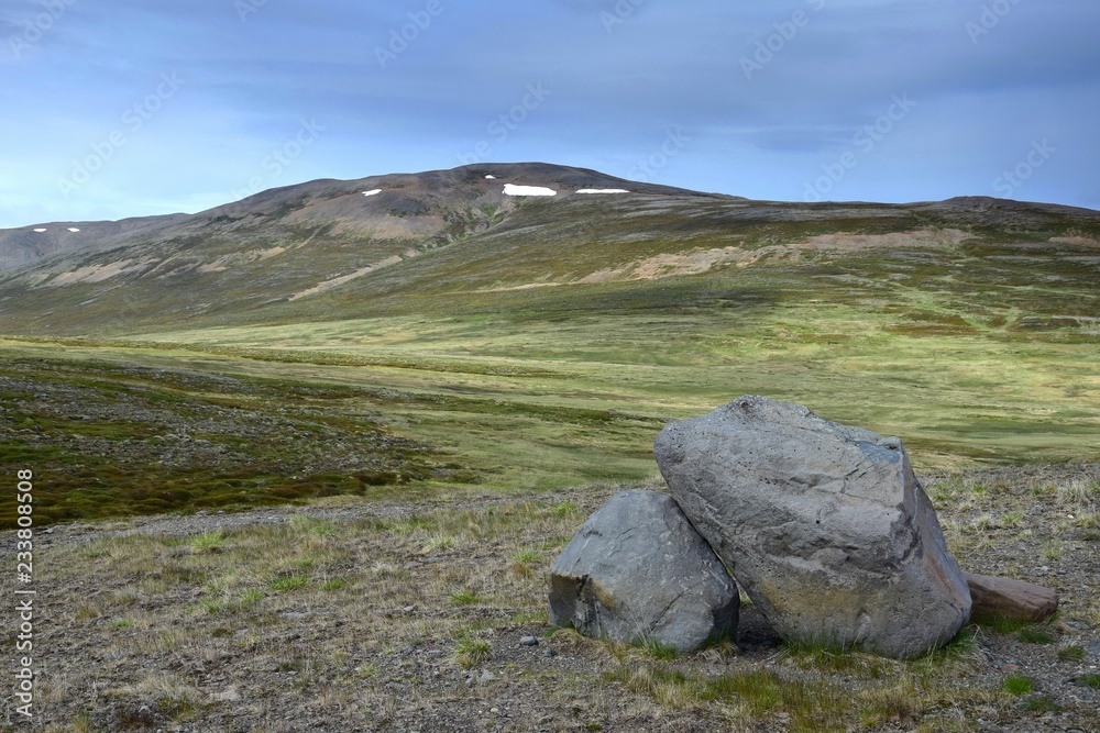Icelandic landscape. A hill with some rocks in front on peninsula Skagi.