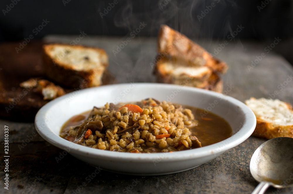 Close up of mushroom barley soup served on a plate Close up of mushroom barley soup served on a plate