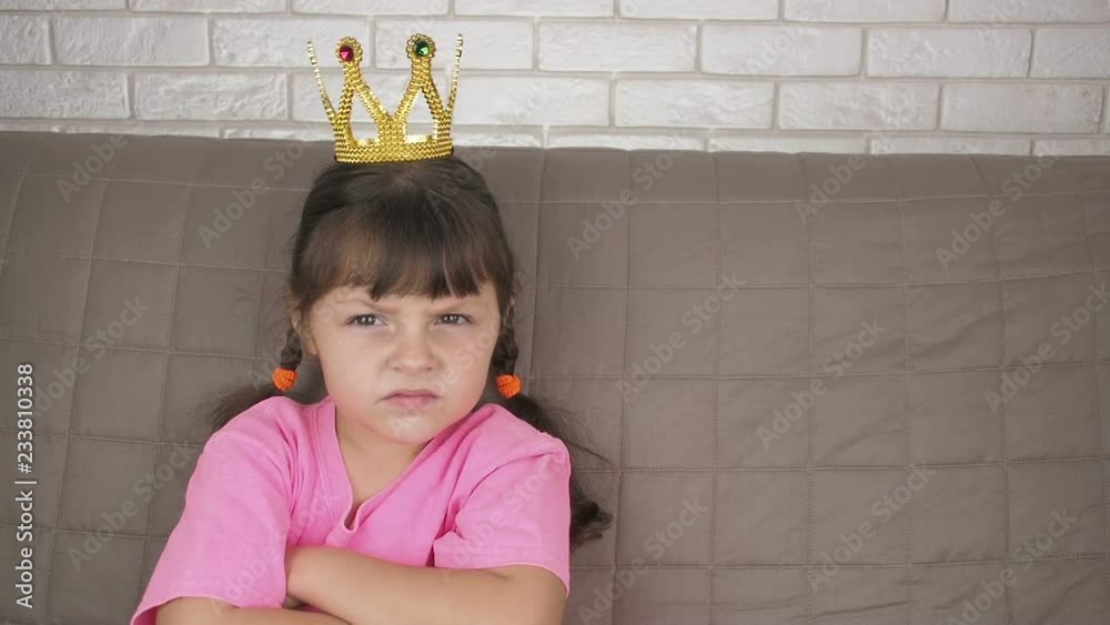 Angry child. Evil princess. Little girl in the crown. Angry child. Evil princess. Little girl in the crown.