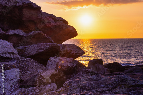 sunset at the granite rocks les rochers of Saint-Guenole Brittany, France