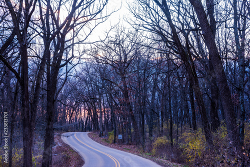 Sunset on the road through New Glarus Woods State Park in Wisconsin.