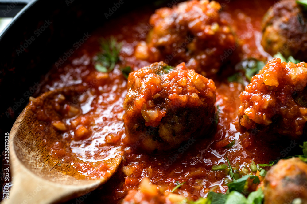 Close up of mackerel fish koftas in tomato and cardamom sauce Close up of mackerel fish koftas in tomato and cardamom sauce