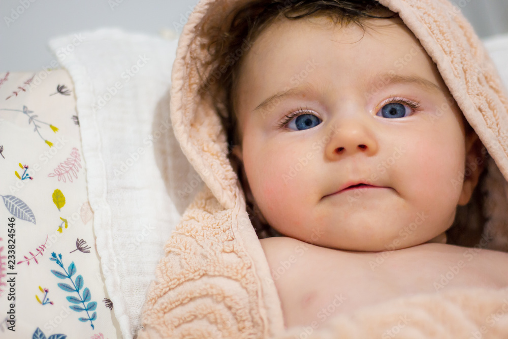 baby in towel after taking a bath baby in towel after taking a bath