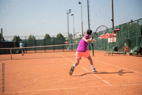 Young tennis player playing forehand © cirkoglu