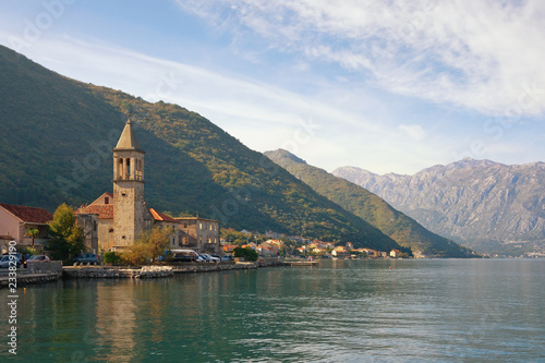 Beautiful Mediterranean landscape. Montenegro, Adriatic Sea, Bay of Kotor. View of ancient town of Stoliv and Name of Mary Church