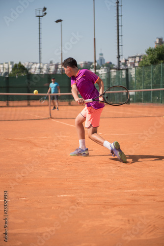 Young tennis player playing backhand © cirkoglu