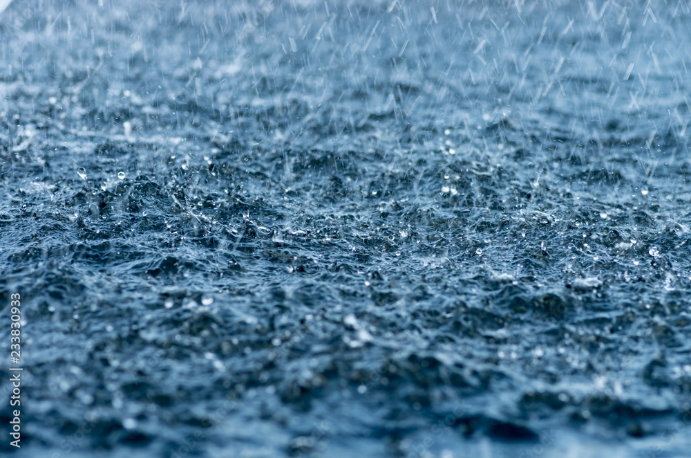 Falling rain drops, splash on water surface Falling rain drops, splash on water surface