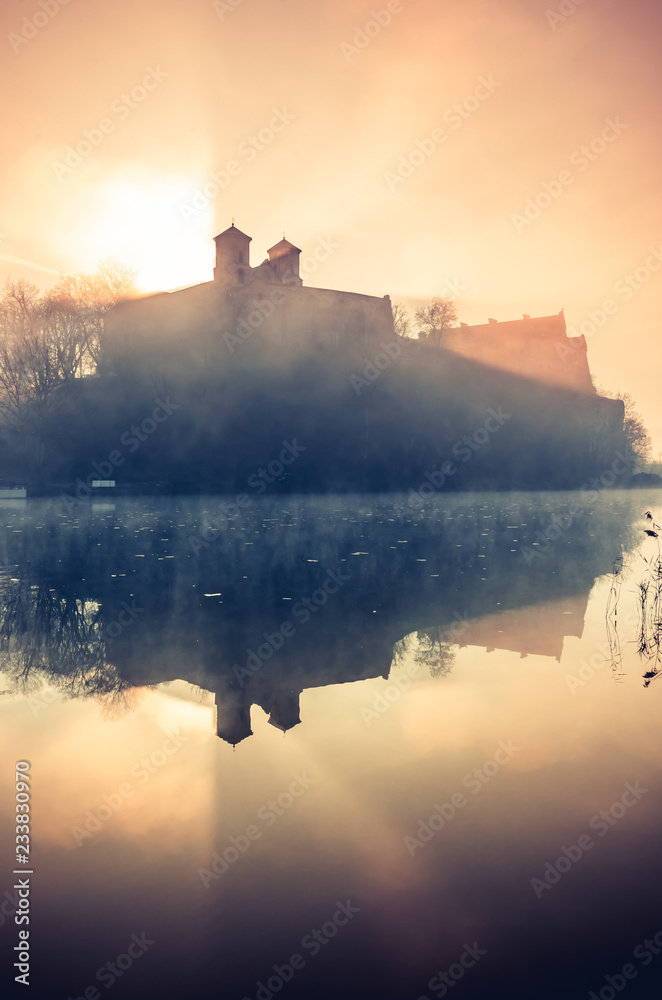 Krakow, Poland, abbey in Tyniec misty sunrise over Vistula river