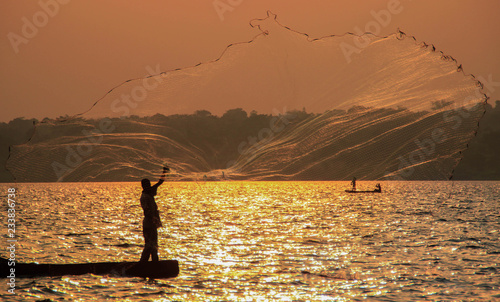 Fisherman throws a net in Lake Victoria. Uganda