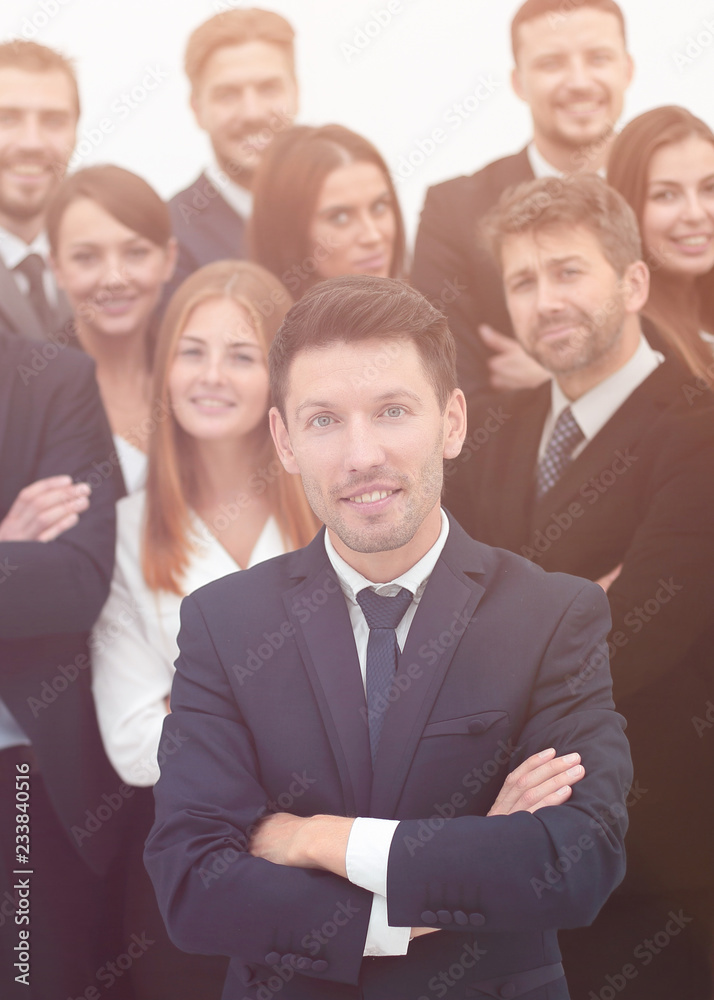 leader standing in front of a large business team leader standing in front of a large business team