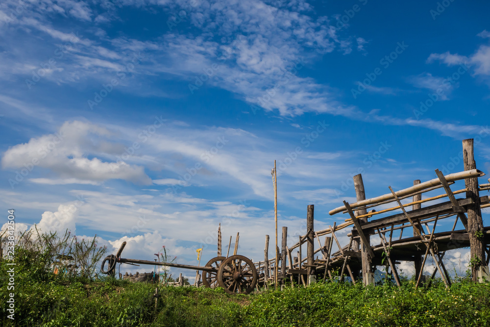 Wood bridge  beside green farm in Nan, northern of Thailand, blue sky, blue sky cloud