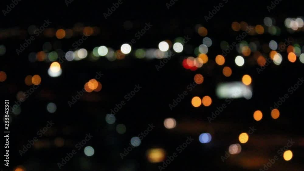 City lights and car lamps during nighttime out of focus