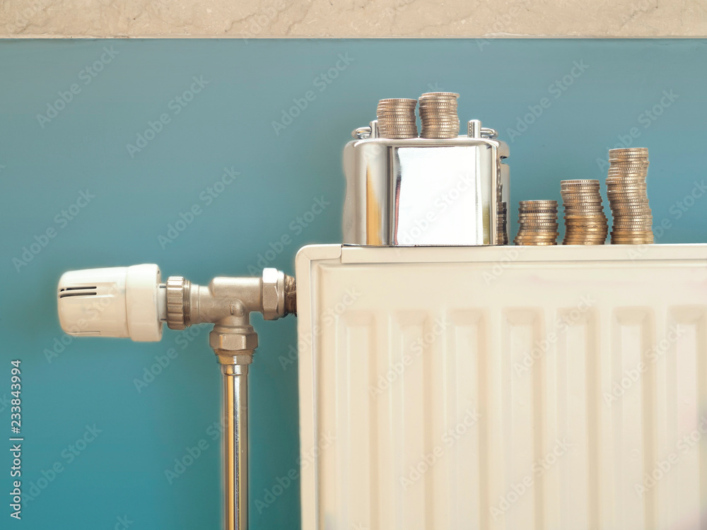 radiators in the house. concept photo about warming-related insulation and saving money radiators in the house. concept photo about warming-related insulation and saving money