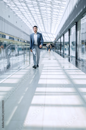 businessman walking in the airport building