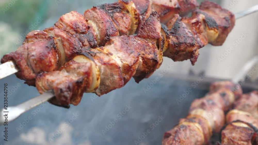 Grilling pork kebab on skewers at bbq Grilling pork kebab on skewers at bbq
