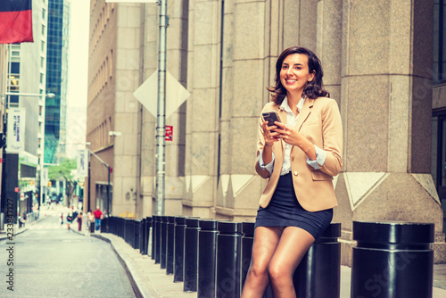 Photography Young American Business Woman traveling, working in New York City, wearing beige