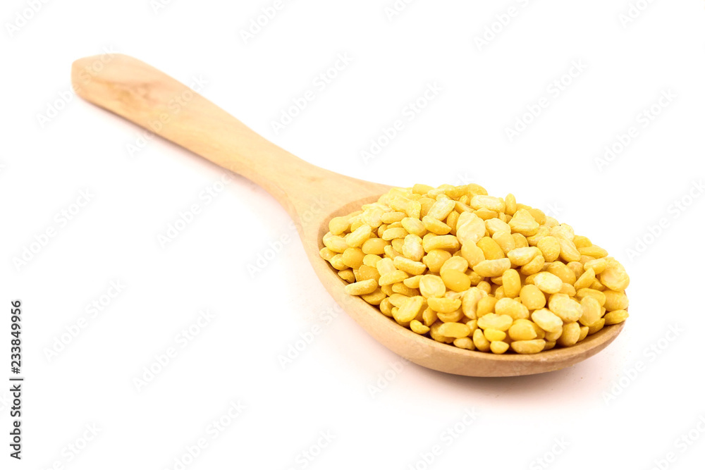 peeled split mung bean in wooden spoon isolated on white background.Ingredients for cooking Healthy and Natural Food concept peeled split mung bean in wooden spoon isolated on white background.Ingredients for cooking Healthy and Natural Food concept
