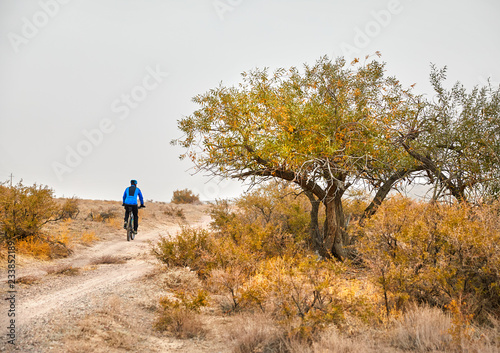 Man ride bicycle in the desert