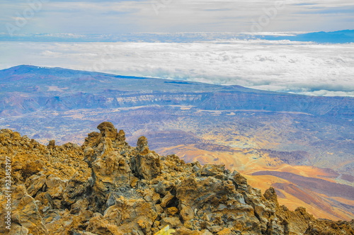 View from top of Teide volcano with clouds in Tenerife, Spain