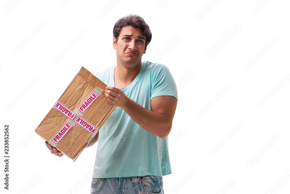 Young handsome man with fragile box ordered from Internet Young handsome man with fragile box ordered from Internet
