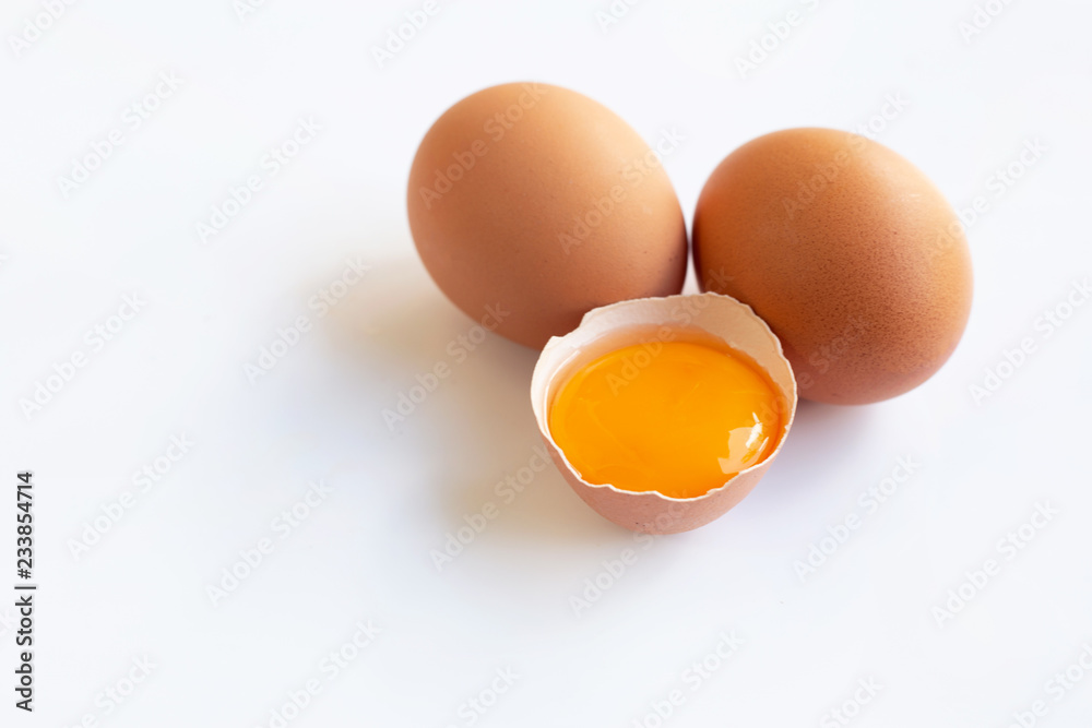 Chicken eggs with yolk on white background. Chicken eggs with yolk on white background.