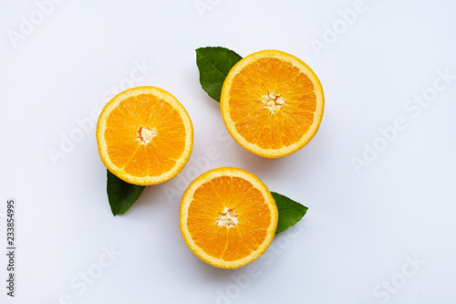 Fresh orange with leaves isolated on white background.