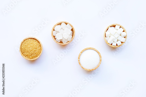 Various types of sugar on white background.