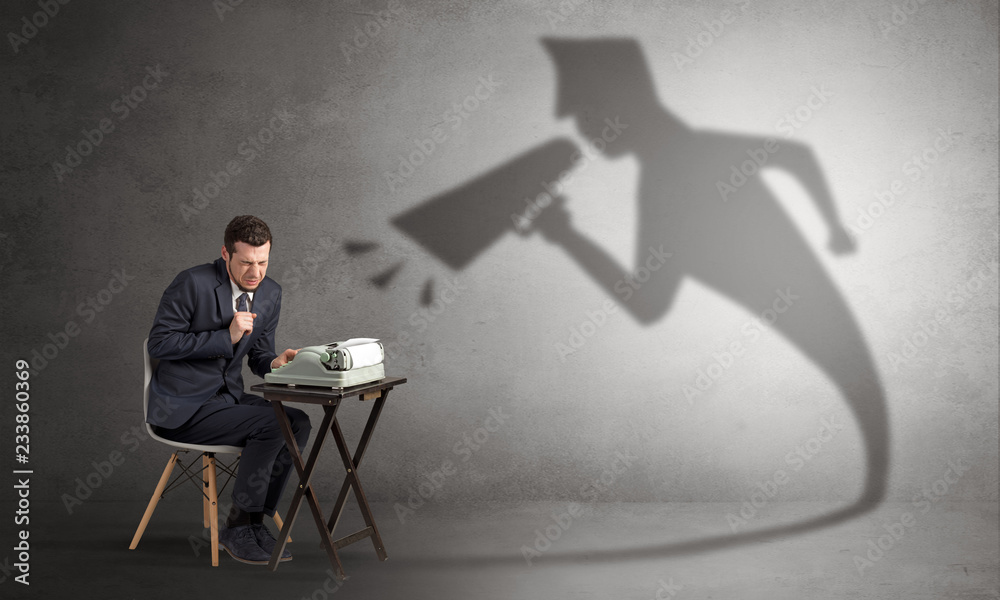 Hard working businessman shadow yelling to himself concept
Hard working businessman shadow yelling to himself concept