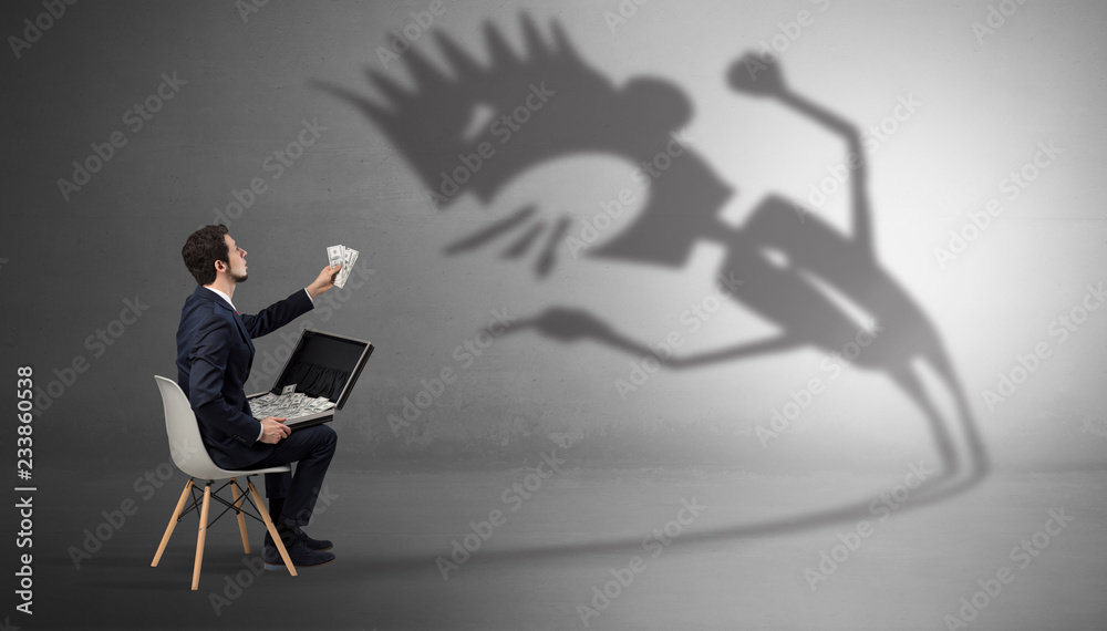 Young businessman staying and negotiate with a monster shadow
Young businessman staying and negotiate with a monster shadow
