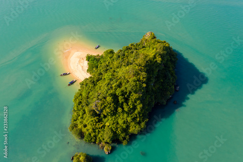 Aerial drone view of the tiny but beautiful beach and tropical island of Koh Nok, in Phang Nga, Thailand