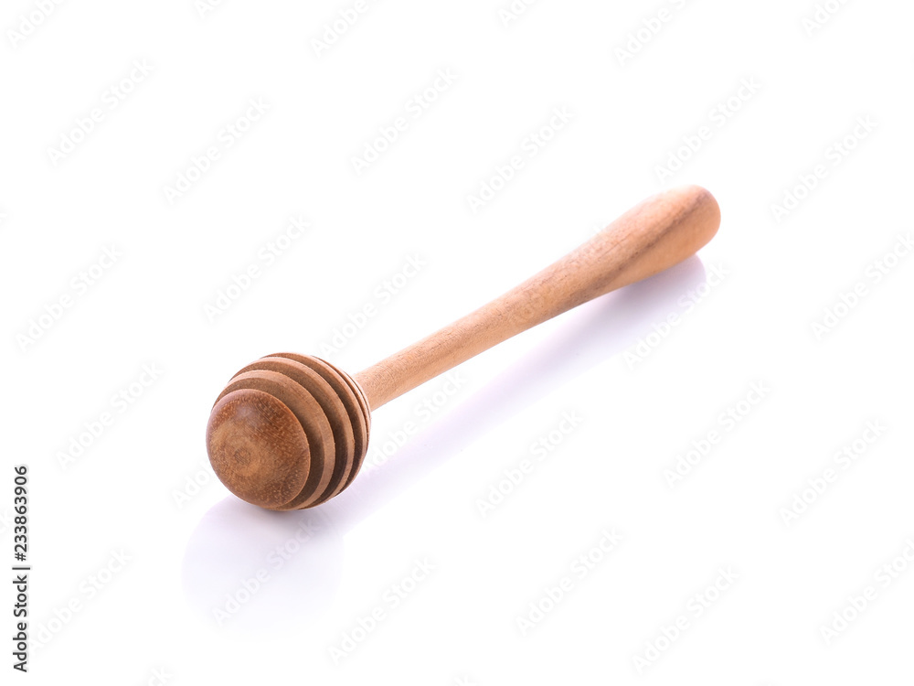 wooden honey stick on white background