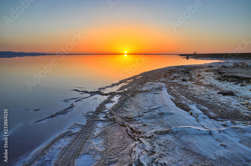 Beautiful sunrise on salt lake Chott el Djerid, Sahara desert, T photo