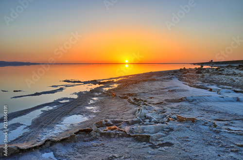 Beautiful sunrise on salt lake Chott el Djerid, Sahara desert, T © Eagle2308