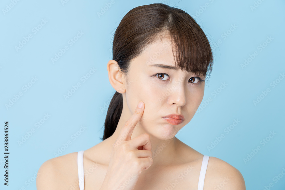 attractive asian woman beauty image on blue background attractive asian woman beauty image on blue background