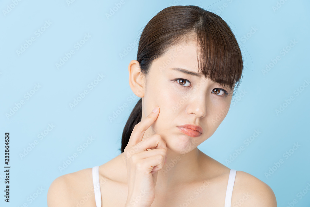 attractive asian woman beauty image on blue background attractive asian woman beauty image on blue background
