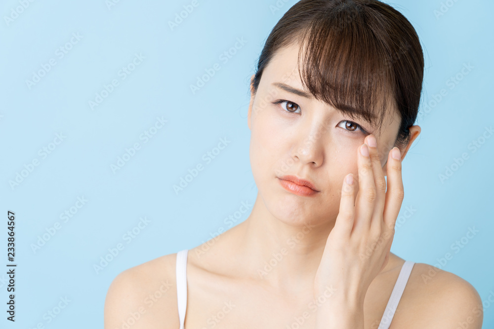 attractive asian woman beauty image on blue background attractive asian woman beauty image on blue background